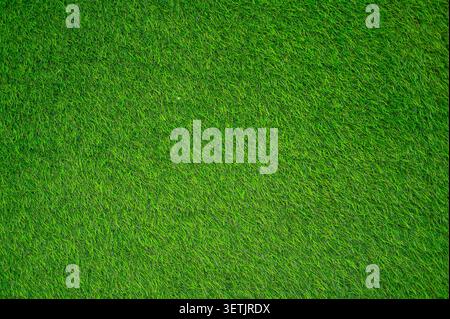 Green synthetic grass as texture or background, grass field, top view Stock Photo