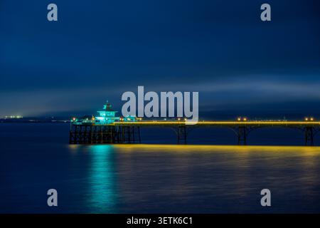 Clevedon Pier in the Severn Estuary illuminated during blue hour, North Somerset, England. Stock Photo