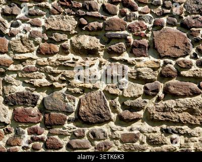 Wall made from concrete and stones, can be used as a background Stock Photo