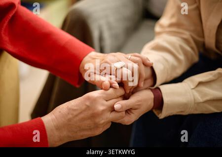 Senior Woman Holding Adult Womans Hands during Emotional Support Stock Photo