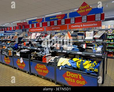 Lidl middle aisle with clothing, accessories and promotional goods in a UK supermarket. Stock Photo