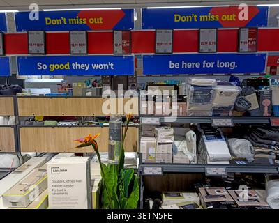 Lidl middle aisle promotional displays with household and seasonal products in an English  UK supermarket. Stock Photo