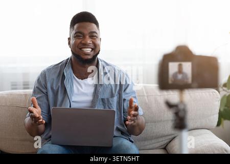 Black Guy Influencer Recording Video Content For His Technology Blog At Home Stock Photo