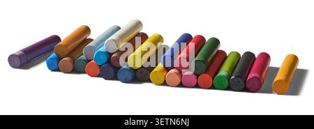 row of colorful oil pastels isolated white background, vivid wax crayons for drawing and coloring, side view with shadow Stock Photo