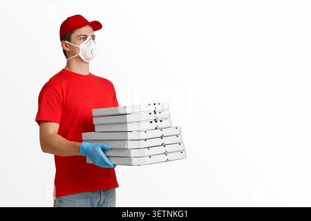 Courier holds many pizza boxes on white background Stock Photo