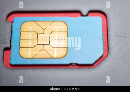 Close-up of a SIM card for use in mobile phones and other electronic devices. Wireless connectivity network cyberspace concept. Stock Photo