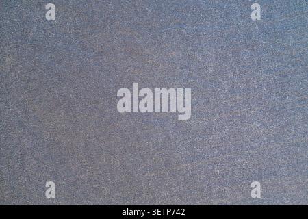 Macro view of woven gray textile surface showing fine threads Stock Photo