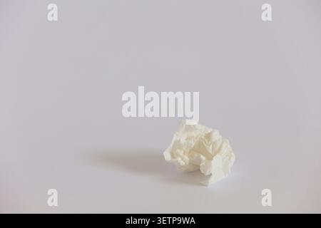Crumpled White Tissue On Minimal Background Symbolizing Cold, Hygiene And Everyday Waste Stock Photo