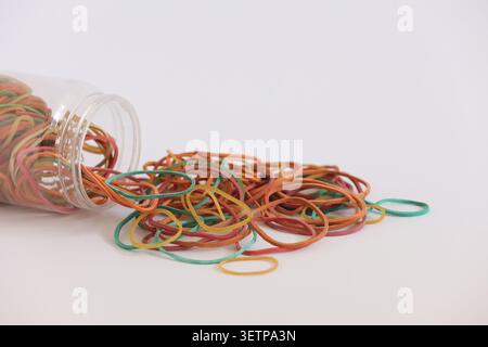Pile Of Colorful Rubber Bands On White Background, Close-Up Still Life Photo Stock Photo