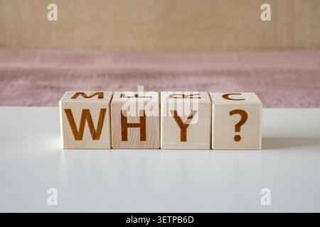 why ?, motivational word made of letters on wooden cubes Stock Photo