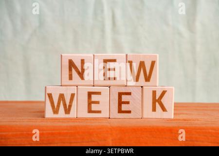 new week, motivational phrase made of letters on wooden cubes Stock Photo