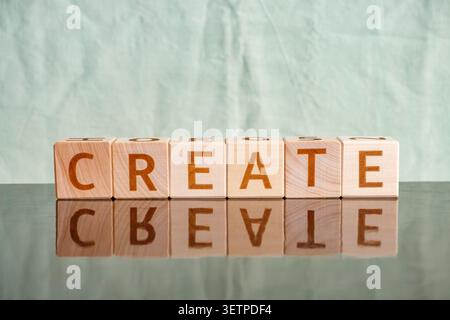 create, motivational word made of letters on wooden cubes Stock Photo
