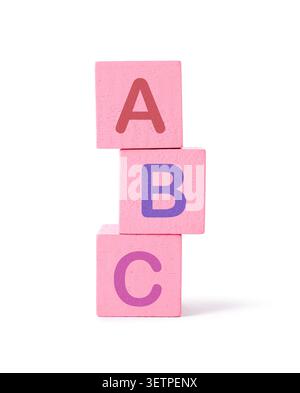 Alphabet learning. Pink cubes with letters isolated on white Stock Photo