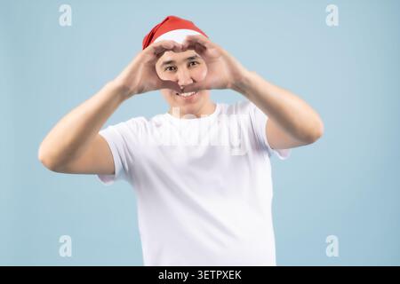 Man looking through his fingers like binoculars Stock Photo