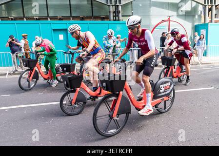 Voi bike, e bike riders taking part in the Race Nocturne Voi Bike event using the app operated hire bikes. Hire bike scheme cyclists in City of London Stock Photo