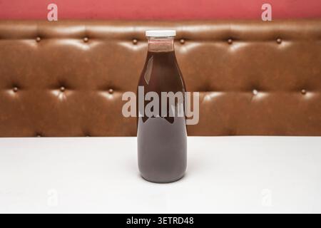filled to the brim with a creamy blend of dark cocoa into which a fluffy white marshmallow slowly sinks. Stock Photo