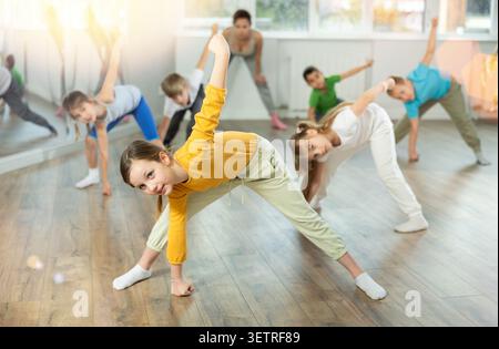 Group of children warming up before dance class Stock Photo