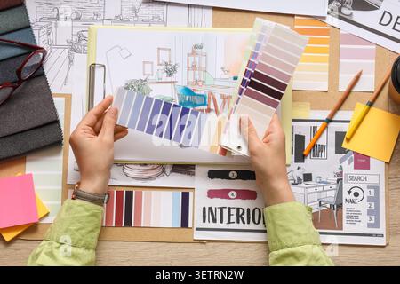 Interior designer choosing color swatches for room design Stock Photo