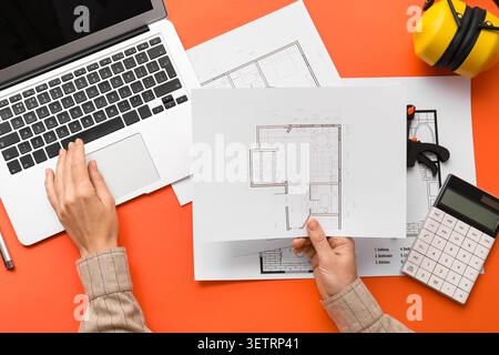 Furing Layout Pln Reviewing architectural floor plans and technical drawings during a ...