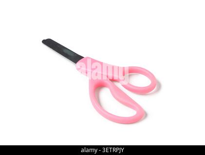 Child-safe scissors with pink handles on white background Stock Photo