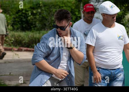 Young Cuban man with Down syndrome dancing with style and energy during an outdoor activity for the "Únicos y Brillantes" social project in Ciego de Á Stock Photo
