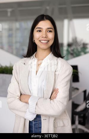 Portrait of young professional Asian female manager posing in office Stock Photo