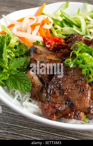 A closeup view of a bowl of grilled pork bun. Stock Photo