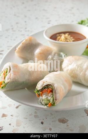 A view of a plate of shrimp pork spring rolls. Stock Photo