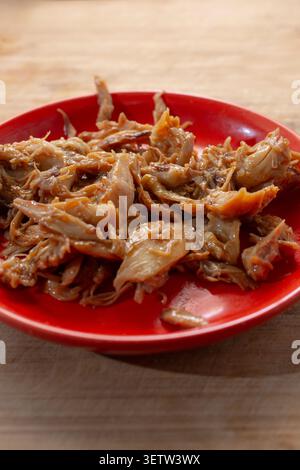 A view of a plate of crockpot BBQ chicken. Stock Photo