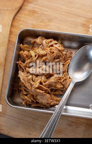 A top down view of a plate of crockpot BBQ chicken. Stock Photo