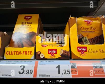 DENIA, SPAIN - January 26, 2026.An assortment of gluten free snacks from Schär brand is arranged on supermarket shelf in Spain. Customers can find Cio Stock Photo