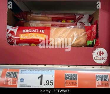 DENIA, SPAIN - January 26, 2026.Gluten free baguette bread is displayed on a shelf in a supermarket in Spain. The product shows its packaging clearly Stock Photo