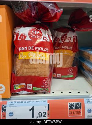 DENIA, SPAIN - January 26, 2026.Carrefour Classic gluten free sliced white bread is displayed in supermarket in Spain. Bread is packed and labeled for Stock Photo