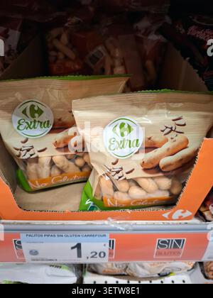DENIA, SPAIN - January 26, 2026.Carrefour Extra brand gluten free breadsticks with sunflower seeds are displayed on a supermarket shelf in Spain. Pack Stock Photo