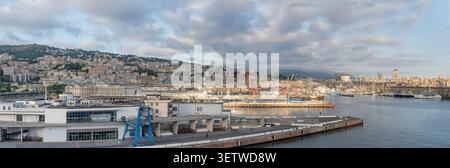 GENOVA, 2026 april 24; large size editorial aerial cityscape with springtime sunset sun shining on city waterfront and  "Porto Antico" harbor, shot in Stock Photo