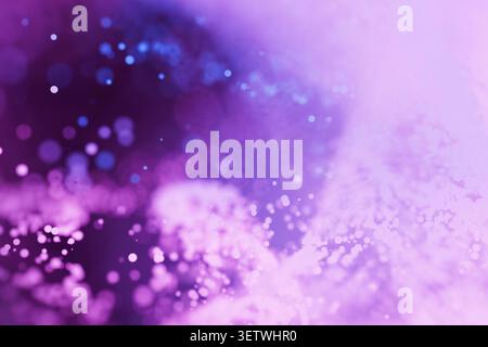 Abstract pastel purple and blue bokeh background with glowing glitter particles and soft waves. Dreamy celestial texture ideal for magical designs, fe Stock Photo