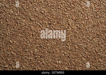 Natural cork board texture background with soft light gradient. Close up of brown corkboard textured surface with gentle light gradient for background Stock Photo