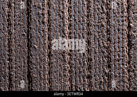 Texture of chocolate wafer bars background. Close up pattern of crispy dark chocolate wafers. Textured sweet dessert backdrop for confectionery market Stock Photo