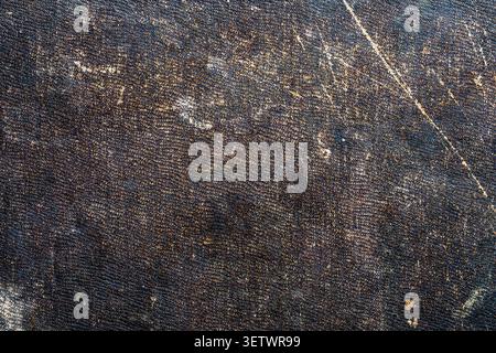 Vintage scratched dark leather texture background with gold patina. Antique worn book cover material. Grunge distressed backdrop with scratches, perfe Stock Photo