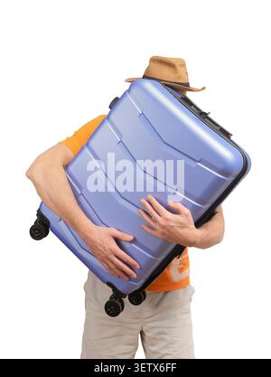Man in casual outfit holding suitcase in hands isolated white background. Traveler carries luggage preparing for trip with simple composition. Concept Stock Photo