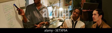 Header of Black Woman Leading Team Brainstorming for Product Development Stock Photo