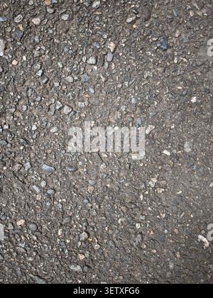 Rough Asphalt Road Texture Background with Small Gravel and Aggregate Surface Pattern, Top View Urban Pavement Detail Stock Photo