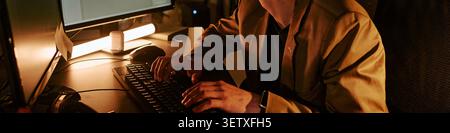 Header of Adult Man Working at Computer during Night Shift in Office Stock Photo