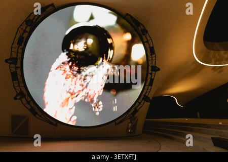 Gelendzhik, Russia - June 14, 2026: Opening of the White Cape wine city. Huge round LED display showing vibrant abstract visuals with warm lighting in Stock Photo