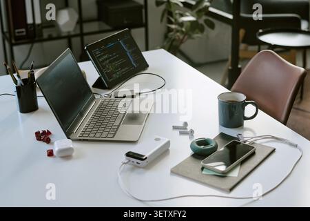 Remote Work Desk Setup Supporting Coding and Digital Productivity Stock Photo