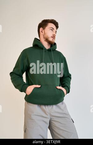 Confident young man in a trendy casual outfit showcasing modern style Stock Photo