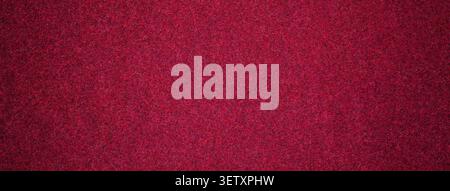 Dark wine red suede fabric background with matte microfiber texture, soft burgundy felt surface with vignette in macro. Stock Photo