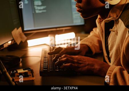 Black Man Coding at Computer for Software Development Project Stock Photo