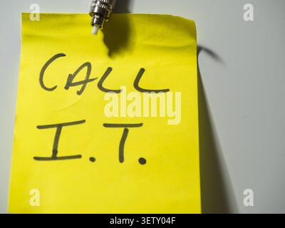 Reminder note to call network technician  Stock Photo