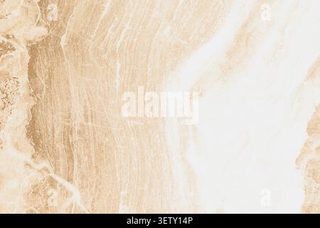 High angle full frame background of a warm beige and brown stone tile texture, featuring organic wavy patterns and veins for a rustic or elegant studi Stock Photo